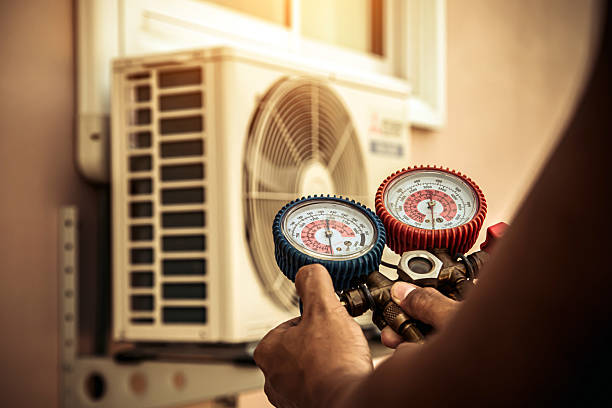 Professional Air Conditioning Service technician working in Manchester, MA